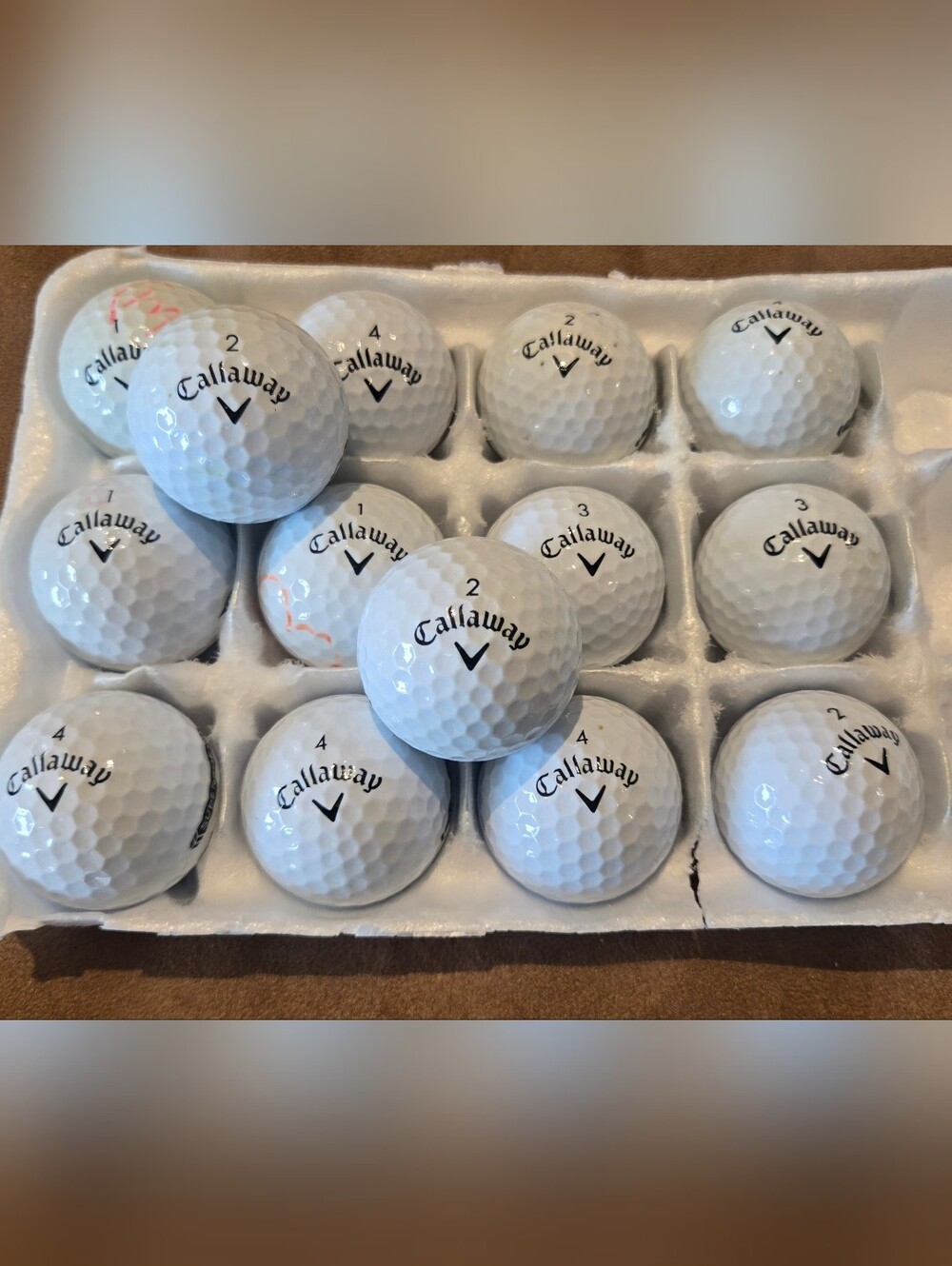 14 Callaway Supersoft white golf balls in Pristine 5A playing condition.